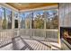 Relaxing screened porch with fireplace and wooded views at 110 Bywater Way, Chapel Hill, NC 27516