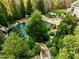 Elevated view of a luxurious pool and meticulously landscaped grounds at 110 Bywater Way, Chapel Hill, NC 27516