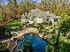 Luxury home with a large pool and beautiful landscaping at 110 Bywater Way, Chapel Hill, NC 27516