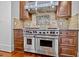 Modern kitchen featuring a Wolf range and custom cabinetry at 110 Bywater Way, Chapel Hill, NC 27516