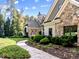 Luxury home with stone and shingle exterior and a stone walkway at 110 Bywater Way, Chapel Hill, NC 27516
