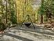 Charming cauldron firepit nestled in a wooded area at 110 Bywater Way, Chapel Hill, NC 27516