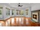 Spacious living room with hardwood floors, fireplace and multiple windows at 110 Bywater Way, Chapel Hill, NC 27516