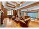 Luxurious library with built-in bookshelves, fireplace, and comfortable seating at 110 Bywater Way, Chapel Hill, NC 27516