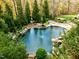 Stunning pool with a unique shape and beautiful natural setting at 110 Bywater Way, Chapel Hill, NC 27516