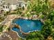 Luxury pool with waterfall and slide; stonework and landscaping at 110 Bywater Way, Chapel Hill, NC 27516