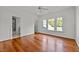 Bright bedroom featuring hardwood floors and access to a private bath at 110 Bywater Way, Chapel Hill, NC 27516