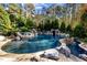 Inviting pool and spa surrounded by lush landscaping at 110 Bywater Way, Chapel Hill, NC 27516