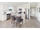 Modern kitchen with white cabinets, granite countertops, and stainless steel appliances at 788 Denburn Pl, Raleigh, NC 27603