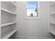 Bright walk-in pantry with ample shelving at 156 Annie Bell Ln, Roxboro, NC 27574