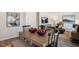 Dining area with a wood table, black chairs, and bowls of apples at 233 Holton St, Smithfield, NC 27577