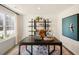 Home office with a large desk, shelving, and inspiring artwork at 233 Holton St, Smithfield, NC 27577