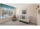 Bright Bedroom with a crib, armchair, and large window at 233 Holton St, Smithfield, NC 27577
