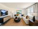 Living room with sectional sofa, a large TV, and a stylish coffee table at 233 Holton St, Smithfield, NC 27577