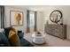 Charming bedroom with a dresser and comfortable seating area at 233 Holton St, Smithfield, NC 27577