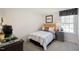 Cozy bedroom with a twin bed, dresser and window at 233 Holton St, Smithfield, NC 27577