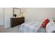 Spacious bedroom with a full bed and dresser at 233 Holton St, Smithfield, NC 27577