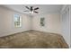 Bright bedroom with neutral carpet and ceiling fan at 9847 Snow Camp Rd, Snow Camp, NC 27349