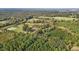 Aerial view of house and expansive property with barns at 9847 Snow Camp Rd, Snow Camp, NC 27349