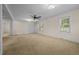 Spacious living room with neutral carpet and ceiling fan at 9847 Snow Camp Rd, Snow Camp, NC 27349