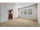 Bright bedroom with carpet flooring and large window at 9847 Snow Camp Rd, Snow Camp, NC 27349