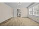 Spacious living room with neutral carpeting and view into the kitchen at 9847 Snow Camp Rd, Snow Camp, NC 27349