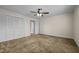 Spacious bedroom with ceiling fan and large closet at 9847 Snow Camp Rd, Snow Camp, NC 27349