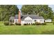 Charming ranch house with brick chimney and landscaped yard at 9847 Snow Camp Rd, Snow Camp, NC 27349