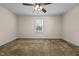 Bedroom features carpet, ceiling fan, and window at 9847 Snow Camp Rd, Snow Camp, NC 27349