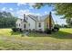 Side view of the house, showing landscaping and walkway at 9847 Snow Camp Rd, Snow Camp, NC 27349
