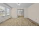 Bright dining room with neutral carpeting at 9847 Snow Camp Rd, Snow Camp, NC 27349