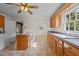 Kitchen with light wood cabinets, tile floor and breakfast nook at 9847 Snow Camp Rd, Snow Camp, NC 27349