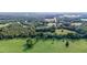 Aerial view of property showing a home and large field at 9847 Snow Camp Rd, Snow Camp, NC 27349