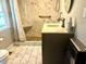 Updated bathroom with walk-in shower and marble tile at 203 Peace St, Oxford, NC 27565