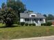 White house with front porch and landscaping at 203 Peace St, Oxford, NC 27565