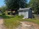 Backyard with shed, pergola and grassy area at 203 Peace St, Oxford, NC 27565