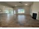 Open living space with tile floors, fireplace, and access to kitchen at 100 Lemon Drop Ln, Franklinton, NC 27525