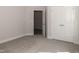 Bedroom with carpet flooring, neutral walls, and access to another room at 100 Lemon Drop Ln, Franklinton, NC 27525