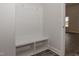Built-in bench with storage and hooks in entryway at 100 Lemon Drop Ln, Franklinton, NC 27525