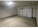 Attached garage with overhead door and concrete floor at 100 Lemon Drop Ln, Franklinton, NC 27525