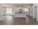 Modern kitchen featuring white cabinets, granite countertops, and an island at 100 Lemon Drop Ln, Franklinton, NC 27525