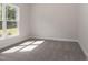 Bright bedroom with a large window, carpet flooring, and neutral walls at 100 Lemon Drop Ln, Franklinton, NC 27525