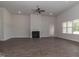 Spacious living room with hardwood floors, fireplace and ceiling fan at 100 Lemon Drop Ln, Franklinton, NC 27525