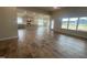 Open living room and kitchen with hardwood floors and lots of natural light at 100 Lemon Drop Ln, Franklinton, NC 27525