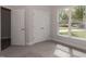 Spacious bedroom with double door closet, carpet flooring, and large window at 100 Lemon Drop Ln, Franklinton, NC 27525
