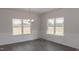 Spacious dining area with hardwood floors and large windows at 100 Lemon Drop Ln, Franklinton, NC 27525