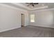 Bright bedroom with carpet flooring, neutral walls, and a ceiling fan. Includes access to a bathroom at 100 Lemon Drop Ln, Franklinton, NC 27525