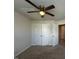 Bedroom with ceiling fan and double door closet at 443 Cross Country Way, Durham, NC 27703