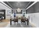 Spacious dining room with dark ceiling, wood floors, chandelier, and view to Gathering room at 1005 Collins Dr, Raleigh, NC 27609