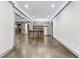 Basement bar area with stone feature wall and rustic wooden countertop at 1005 Collins Dr, Raleigh, NC 27609